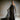 Schmales Abendkleid CELESTIAL mit Bustier‑Oberteil und Organza‑Volant, Frontansicht im Studio.