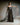 Schmales Abendkleid CELESTIAL mit Bustier‑Oberteil und Organza‑Volant, Frontansicht im Studio.