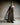 Schmales Abendkleid CELESTIAL mit Bustier‑Oberteil und Organza‑Volant, Frontansicht im Studio.