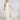 One‑Shoulder Brautkleid ASH, schmales Hochzeitskleid mit hohem Schlitz und abnehmbarem, voluminösem Ärmel aus transparentem Seidenorganza, Frontansicht im Studio.