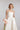 Bustier Hochzeitskleid LIME aus luxuriösem Seiden Mikado mit weit schwingendem Rock und eleganter Schleppe, Frontansicht im Studio.