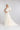 Brautkleid ASH mit One‑Shoulder Ausschnitt, schmalem Rock und hohem Schlitz, kombiniert mit WIND transparentem Überrock aus Seidenorganza mit Schleppe, Frontansicht.