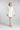 Kurzes Braut Blazer‑Kleid CARRY mit eleganter, moderner Silhouette und V‑Ausschnitt, Frontansicht im Studio.