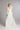 FLORENTINA & FIRN im Studio, zarter Layer‑Look mit transparenten Ärmeln, V‑Ausschnitt und langer Schleppe aus feinem Seidenchiffon.